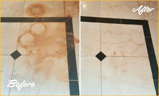 Before and After Picture of a Silverhill Hard Surface Restoration Service on a Marble Floor to Eliminate Rust Stains